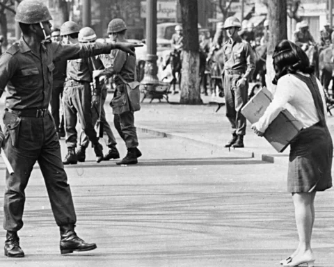 Police officer represses student during the Military dictatorship in Brazil.